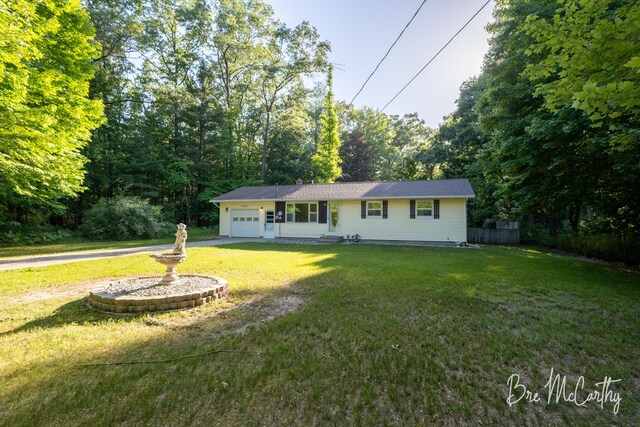 3541 Orshal Rd, Whitehall, MI 49461 - ranch-style home featuring an attached garage and a front yard