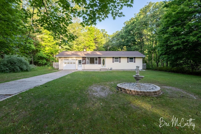 3541 Orshal Rd, Whitehall, MI 49461 - ranch-style home featuring driveway, an attached garage, and a front lawn