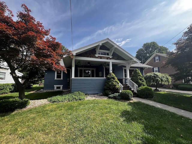 950 College Ave, Adrian, MI 49221 - bungalow-style home featuring a front yard and covered porch