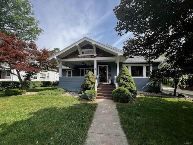 950 College Ave, Adrian, MI 49221 - view of front of property featuring a front lawn and a porch