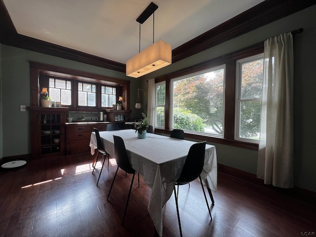 950 College Ave, Adrian, MI 49221 - dining space with crown molding and dark wood-style floors