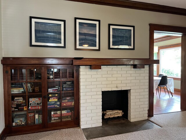 950 College Ave, Adrian, MI 49221 - detailed view of carpet, crown molding, and a fireplace