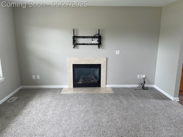 8090 Majestic Blvd, Fowlerville, MI 48836 - unfurnished living room with carpet flooring and a premium fireplace