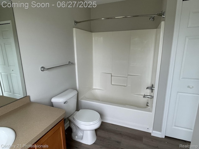 8090 Majestic Blvd, Fowlerville, MI 48836 - full bathroom featuring vanity, wood finished floors, and bathtub / shower combination