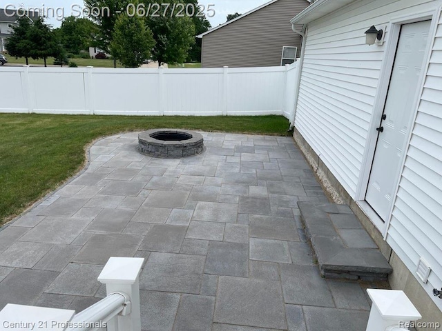 8090 Majestic Blvd, Fowlerville, MI 48836 - view of patio with a fire pit