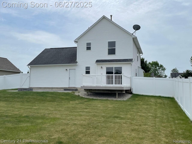 8090 Majestic Blvd, Fowlerville, MI 48836 - rear view of house with a wooden deck, a fenced backyard, and a shingled roof