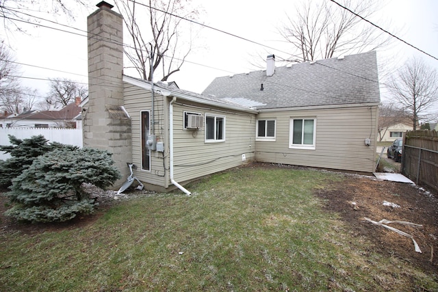 22779 Almond Ave, Eastpointe, MI 48021 - rear view of property featuring a chimney, a wall mounted AC, and a shingled roof