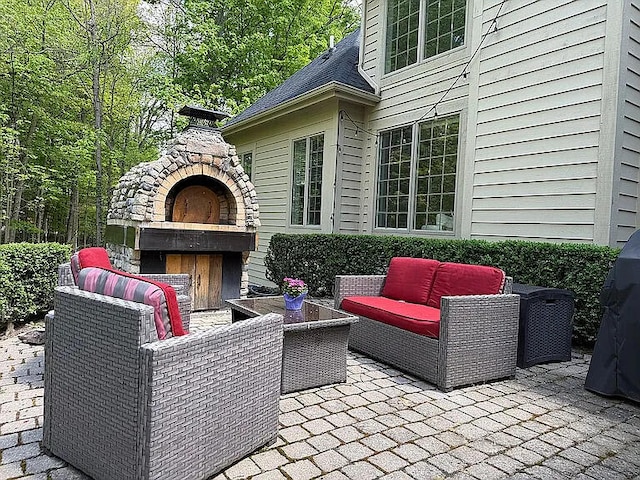 8255 Shady Brook Ln, Flushing, MI 48433 - view of patio with an outdoor living space with a fireplace