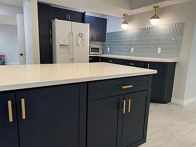 8255 Shady Brook Ln, Flushing, MI 48433 - kitchen with white fridge with ice dispenser, decorative backsplash, dark cabinets, and light countertops