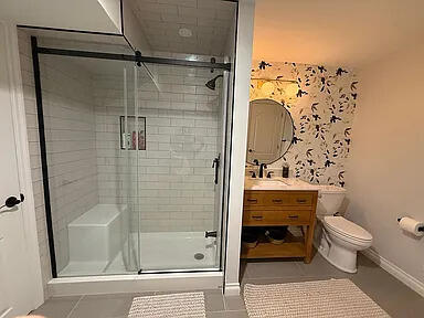 8255 Shady Brook Ln, Flushing, MI 48433 - bathroom with vanity, a stall shower, and tile patterned flooring