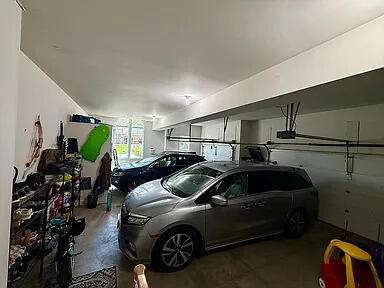 8255 Shady Brook Ln, Flushing, MI 48433 - garage featuring a garage door opener