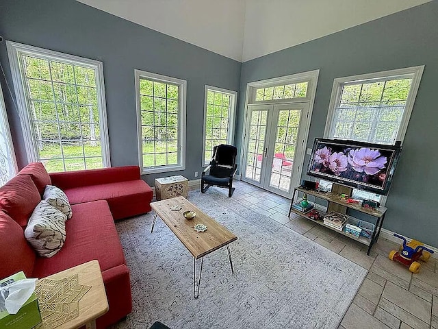 8255 Shady Brook Ln, Flushing, MI 48433 - living room with healthy amount of natural light, tile patterned floors, and french doors