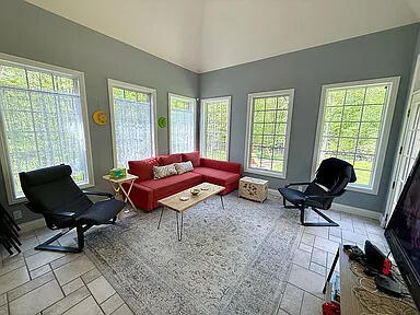 8255 Shady Brook Ln, Flushing, MI 48433 - living area with baseboards and high vaulted ceiling