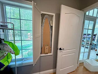 8255 Shady Brook Ln, Flushing, MI 48433 - detailed view of baseboards and wood finished floors