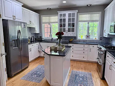 8255 Shady Brook Ln, Flushing, MI 48433 - kitchen with stainless steel appliances, light wood-style floors, white cabinetry, and recessed lighting
