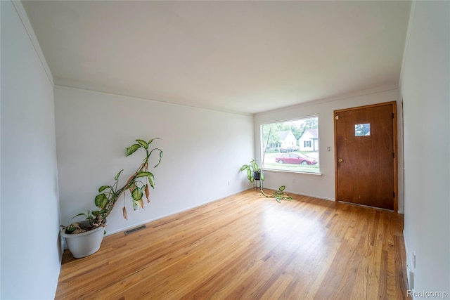 17213 Anne Ave, Detroit, MI 48101 - foyer entrance featuring light wood-type flooring and ornamental molding