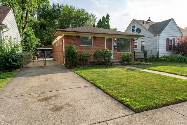 17213 Anne Ave, Detroit, MI 48101 - view of front of property featuring brick siding, a gate, concrete driveway, and a carport