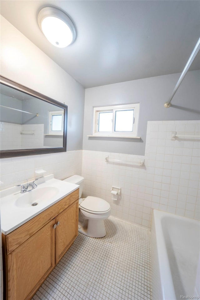 17213 Anne Ave, Detroit, MI 48101 - full bath featuring tile walls, vanity, tile patterned flooring, wainscoting, and shower / bathtub combination