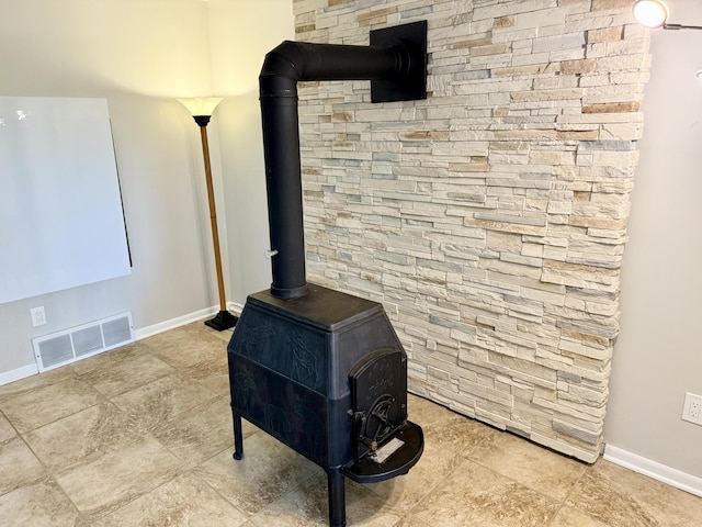 13955 Rattalee Lake Rd, Davisburg, MI 48350 - detailed view of a wood stove and baseboards
