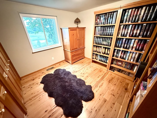 13955 Rattalee Lake Rd, Davisburg, MI 48350 - sitting room featuring wood-type flooring and baseboards