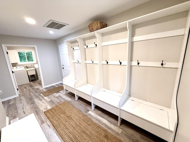 13955 Rattalee Lake Rd, Davisburg, MI 48350 - mudroom with washer / clothes dryer, light wood finished floors, and recessed lighting