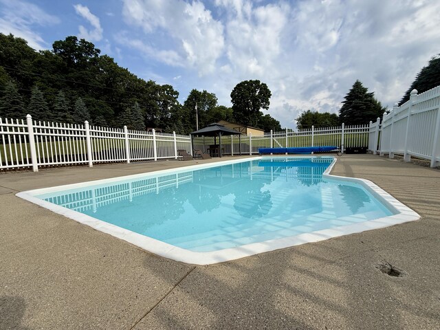 13955 Rattalee Lake Rd, Davisburg, MI 48350 - view of swimming pool with a gazebo, a fenced backyard, and a patio area