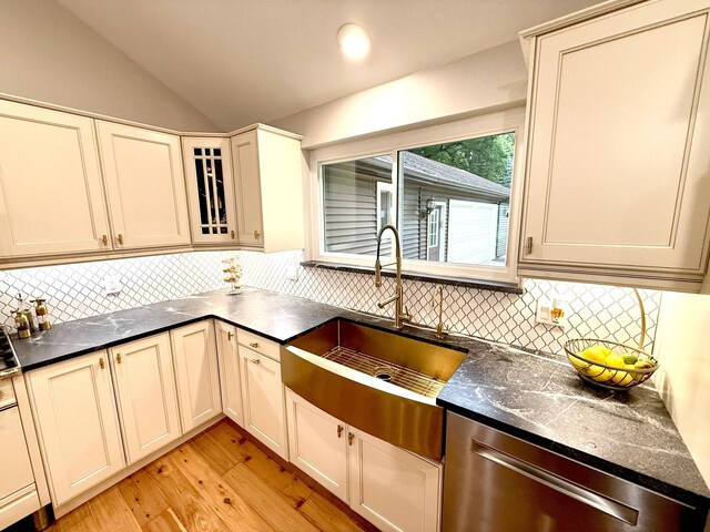 13955 Rattalee Lake Rd, Davisburg, MI 48350 - kitchen with dishwasher, light wood-style floors, dark countertops, backsplash, and lofted ceiling