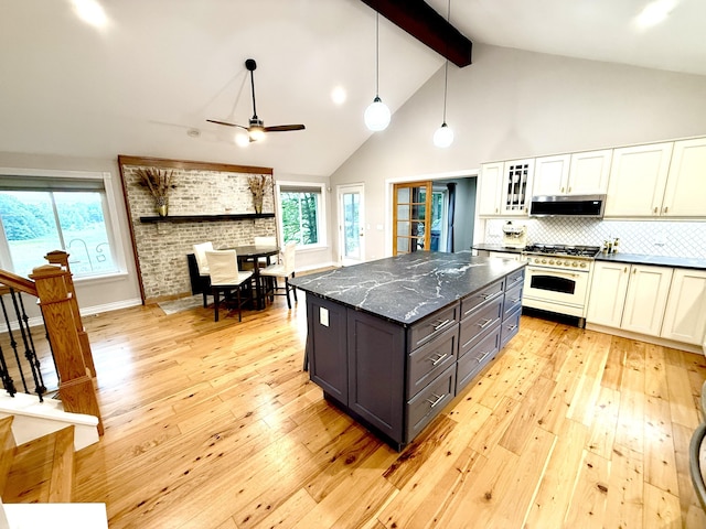 13955 Rattalee Lake Rd, Davisburg, MI 48350 - kitchen with high end white range oven, range hood, light wood-type flooring, beamed ceiling, and ceiling fan