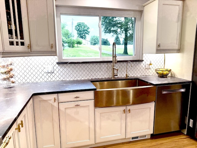 13955 Rattalee Lake Rd, Davisburg, MI 48350 - kitchen with dishwasher, backsplash, and glass insert cabinets