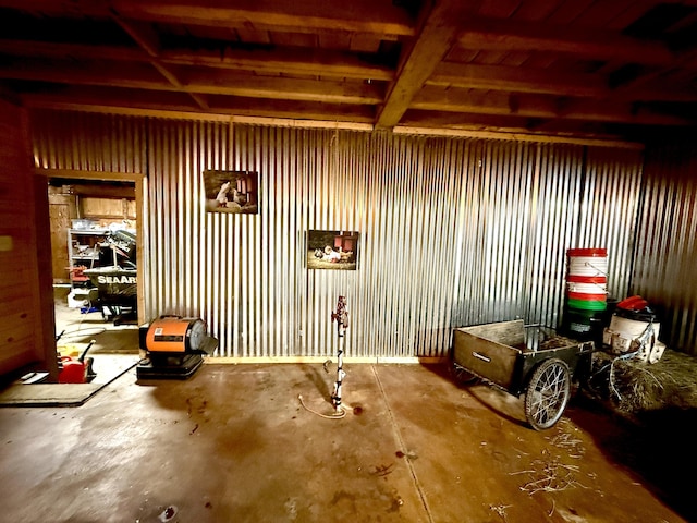 13955 Rattalee Lake Rd, Davisburg, MI 48350 - miscellaneous room featuring unfinished concrete flooring and a garage