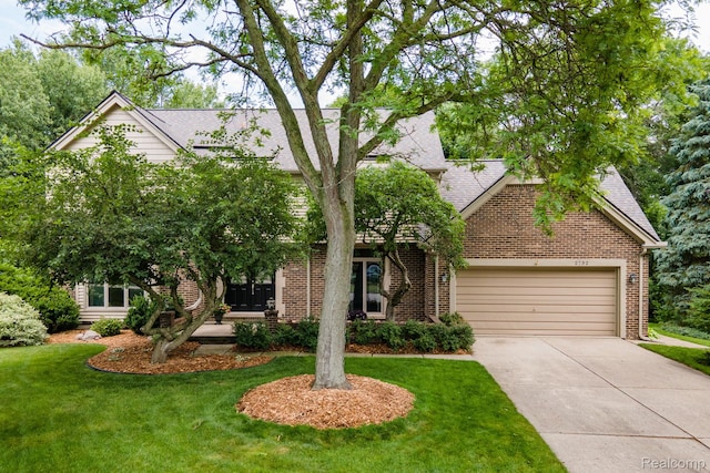 2732 Winter Park Ct, Rochester Hills, MI 48309 - view of property hidden behind natural elements featuring driveway, brick siding, an attached garage, a front yard, and french doors