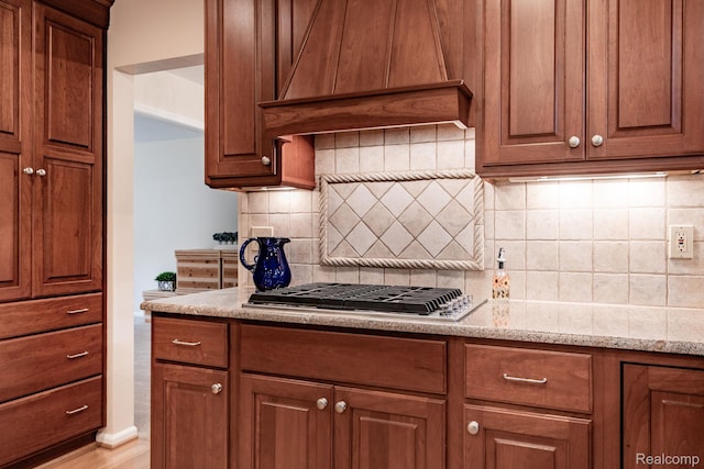 2732 Winter Park Ct, Rochester Hills, MI 48309 - kitchen with premium range hood, backsplash, and brown cabinets