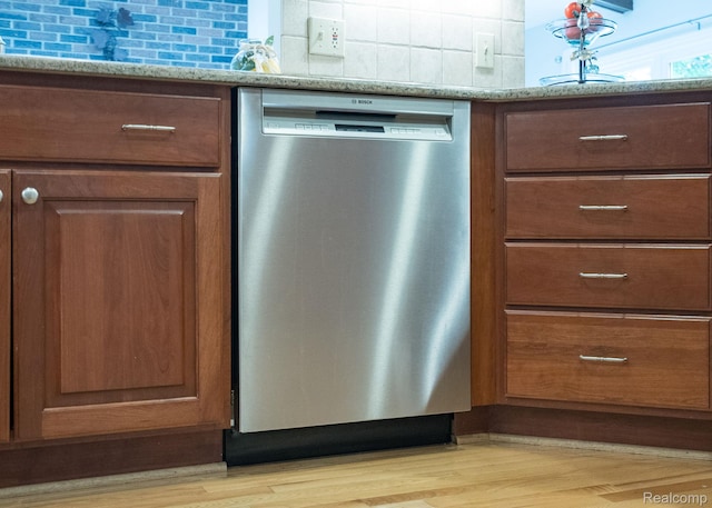 2732 Winter Park Ct, Rochester Hills, MI 48309 - kitchen view of dishwasher, tasteful backsplash, light wood-style floors, and brown cabinetry