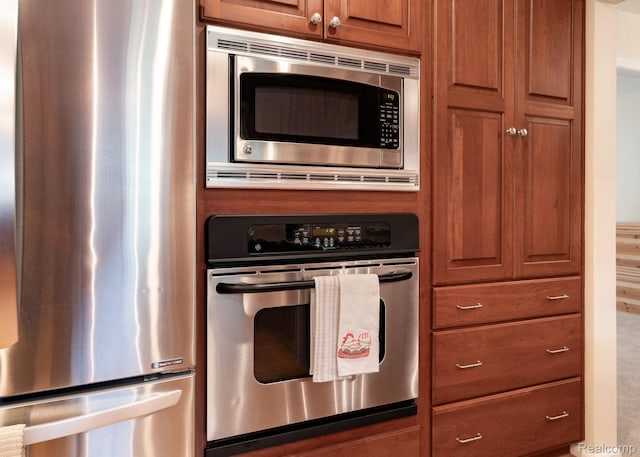 2732 Winter Park Ct, Rochester Hills, MI 48309 - kitchen featuring stainless steel appliances and brown cabinetry