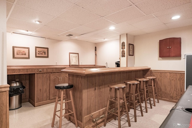 2732 Winter Park Ct, Rochester Hills, MI 48309 - indoor wet bar featuring a wainscoted wall, a drop ceiling, wooden walls, light floors, and recessed lighting