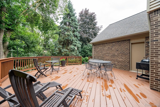 2732 Winter Park Ct, Rochester Hills, MI 48309 - wooden deck featuring outdoor dining space and view of wooded area