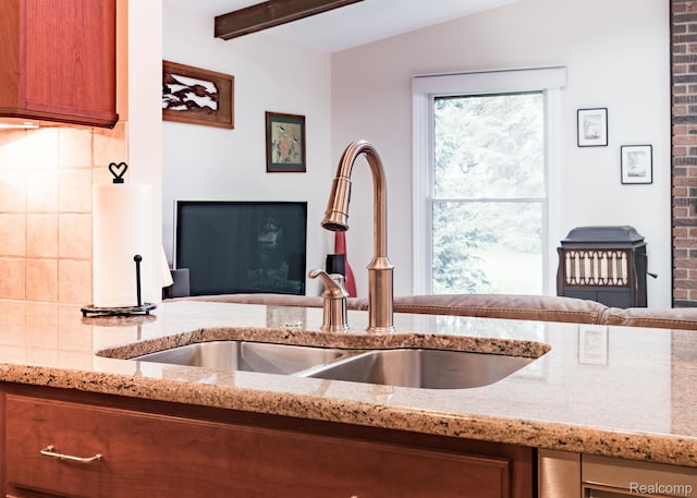 2732 Winter Park Ct, Rochester Hills, MI 48309 - kitchen featuring light stone counters, brown cabinets, and open floor plan