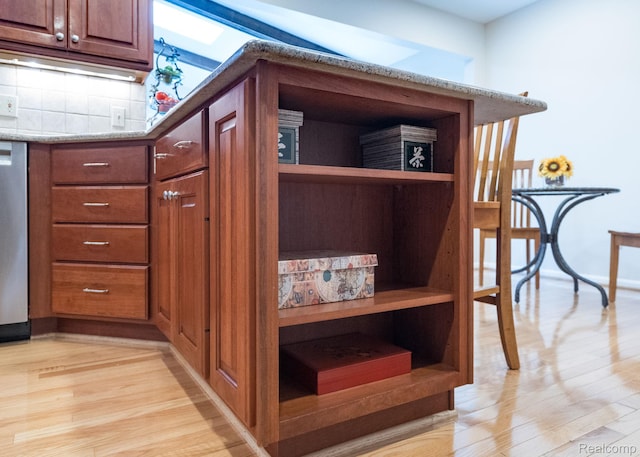 2732 Winter Park Ct, Rochester Hills, MI 48309 - kitchen view of light wood-style floors, open shelves, tasteful backsplash, light stone counters, and dishwasher