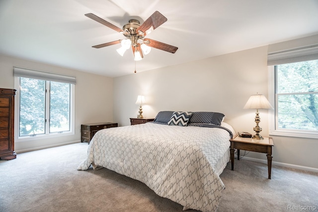 2732 Winter Park Ct, Rochester Hills, MI 48309 - bedroom with multiple windows, carpet flooring, and a ceiling fan