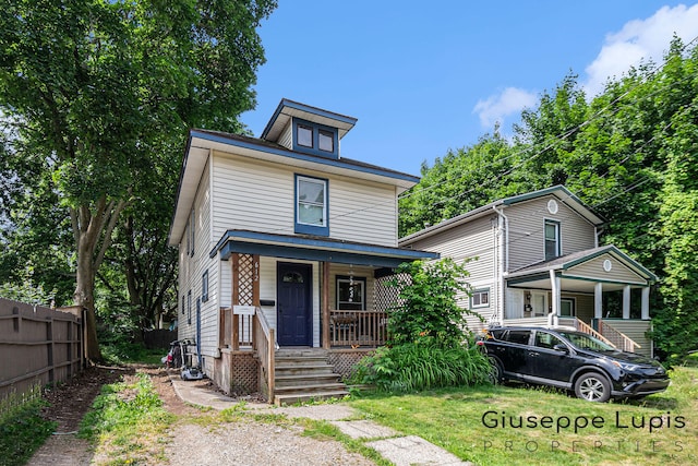 612 Norman St, Lansing, MI 48910 - american foursquare style home with covered porch