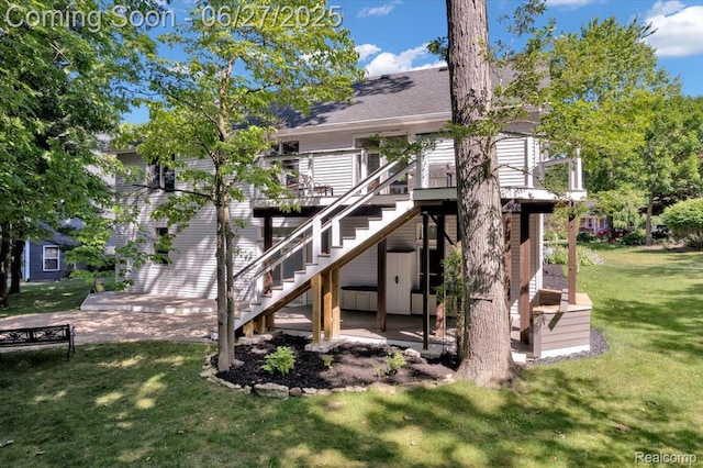 1522 Oregon Ct, Waterford, MI 48327 - rear view of house with stairs, a wooden deck, a yard, and roof with shingles