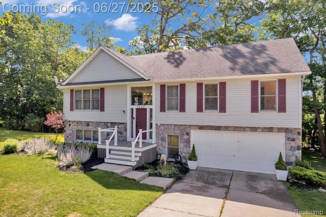 1522 Oregon Ct, Waterford, MI 48327 - bi-level home with stone siding, an attached garage, concrete driveway, a front lawn, and a shingled roof