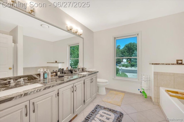 1522 Oregon Ct, Waterford, MI 48327 - full bathroom featuring double vanity, plenty of natural light, tile patterned flooring, and a garden tub