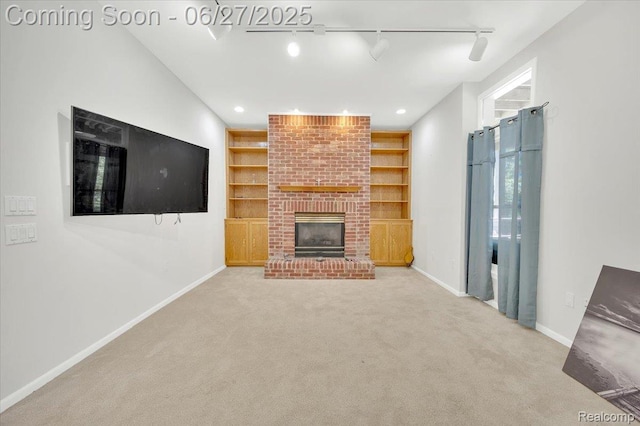 1522 Oregon Ct, Waterford, MI 48327 - unfurnished living room with rail lighting, carpet floors, a fireplace, built in shelves, and recessed lighting