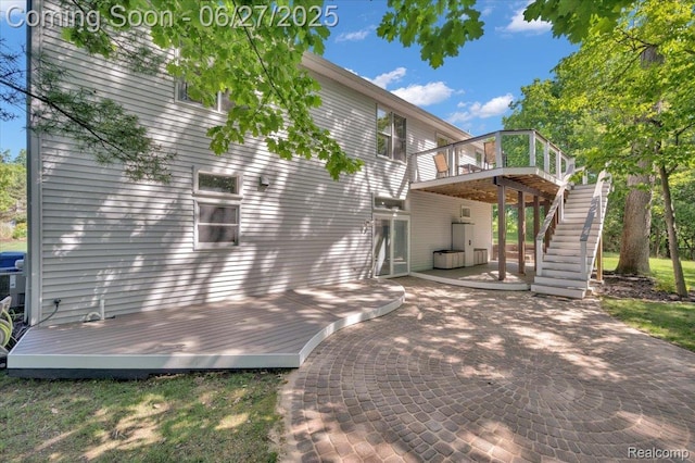 1522 Oregon Ct, Waterford, MI 48327 - view of home's exterior featuring a wooden deck, a patio area, and stairway