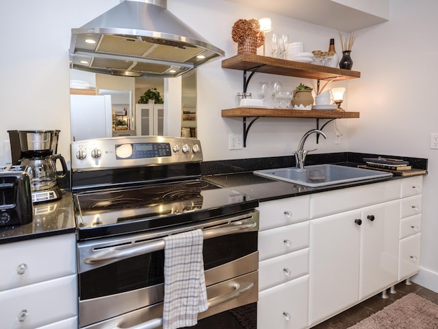 4040 Greenleaf Cir Unit 108, Kalamazoo, MI 49008 - kitchen featuring stainless steel electric stove, island range hood, freestanding refrigerator, white cabinets, and open shelves