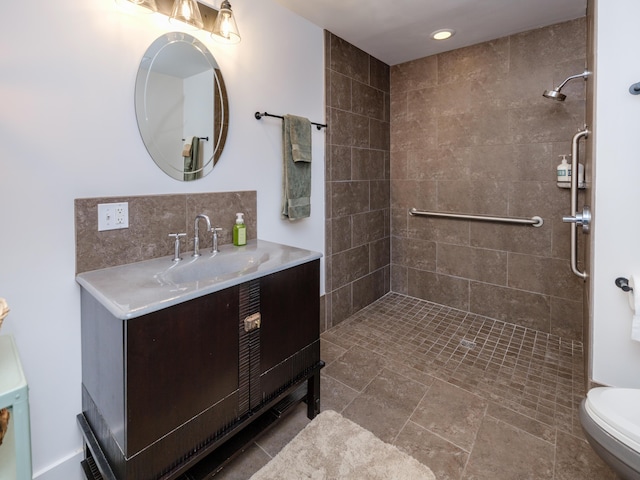 4040 Greenleaf Cir Unit 108, Kalamazoo, MI 49008 - bathroom with vanity, a tile shower, and recessed lighting