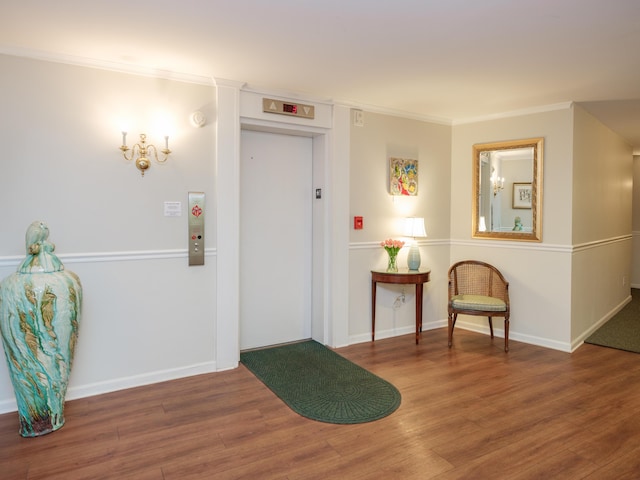 4040 Greenleaf Cir Unit 108, Kalamazoo, MI 49008 - foyer with wood finished floors, ornamental molding, and elevator