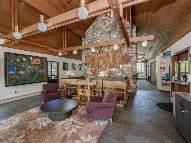 4040 Greenleaf Cir Unit 108, Kalamazoo, MI 49008 - living room with a wood ceiling with exposed beams, high vaulted ceiling, and stone tile flooring