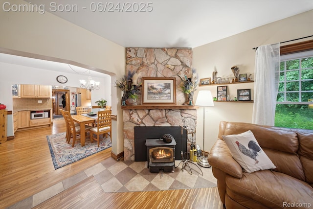 8450 Rosbolt Rd, Willis, MI 48191 - living area featuring light wood-style floors and a chandelier